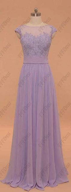 a purple dress on a mannequin dummy with lace detailing and sheer neckline