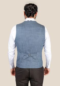 Experience ultimate style and premium quality with our Mid Blue Hopsack Vest. Designed for the fashionable and the bold with a premium bamboo/wool/linen/silk blend from Cavani, this custom-made vest is sure to catch eyes and elevate any look. Make a statement and stand out from the crowd with this stylish addition to your wardrobe. Classic Blue Cotton Vest, Casual Blue V-neck Vest, Washed Blue Sleeveless Cotton Vest, Cheap Blue V-neck Vest, Blue V-neck Denim Vest Casual, Suit Guide, Vest And Tie, Linen Suits, Cotton Blazer