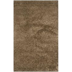 an area rug with brown carpeting