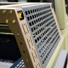 the back end of a bench with holes in it