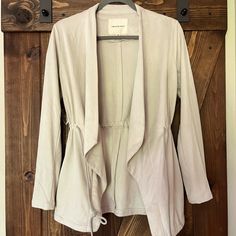 New Without Tags! The Drawstring Waist Makes This Quite Flattering. It Is Light Tan/Grey In Color. Cheap Cotton Open Front Outerwear, Cheap Stretch Outerwear With V-neck, Cheap V-neck Outerwear For Spring, Light Tan, Drawstring Waist, Cover Up, Jackets & Coats, Jackets For Women, Thread