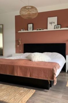 a bed sitting in a bedroom on top of a hard wood floor