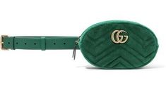 For SS18, Gucci reimagines its GG Marmont style in emerald-green quilted velvet for this belt bag. It's crafted in Italy, and features an antiqued gold-tone metal front plaque with the top-zip opening to a red satin lining. It's designed to be worn high on the waist, and can also be slung across the body and carried as a clutch, thanks to the detachable and adjustable buckle-fastening strap. Position yours over the house's separates for an on-brand look. Size 95cm Rectangular Leather Gucci Belt Bag, Gucci Green Bags With Gold-tone Hardware, Green Gucci Bag With Gold-tone Hardware, Designer Formal Belt Bag With Removable Belt, Luxury Rectangular Bags With Belt Detail, Designer Rectangular Bag With Belt Detail, Luxury Formal Bag With Belt Detail, Chic Green Gucci Bag, Luxury Belted Bag For Formal Occasions