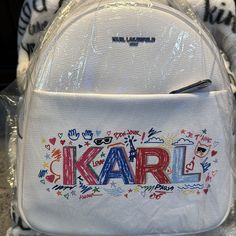 Nwot Karl Small Backpack White With Karl Absolutely No Marks White Leather Backpack For Back To School, White Leather Backpack With Dust Bag, White Backpack With Removable Pouch For Errands, White Standard Backpack, White Standard Backpack For Errands, White Backpack For Errands, Everyday White Backpack With Logo, White Travel Bag With Embroidered Logo, White Logo Backpack For Everyday Use