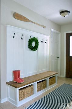 the entryway is clean and ready to be used as a storage area for shoes