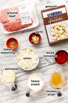 ingredients to make an italian pasta dish laid out on a marble counter top