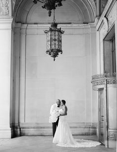 A bride and groom embrace under beautiful historic architecture during their Detroit Michigan wedding Garden Theater, Historic Theater, Downtown Detroit, Vintage Invitations, Detroit Wedding, Film Wedding, Glam Wedding, Vintage Rentals, Art Deco Wedding