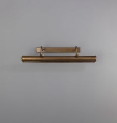 a metal shelf mounted to the side of a wall