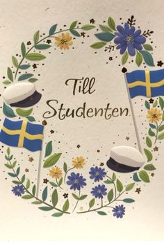 a wreath with two swedish flags and flowers around it that says tile studenten