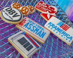 some cookies are on a glass platter with the names of different countries and symbols