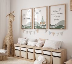 a room with two giraffes hanging on the wall and some storage bins