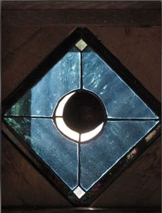 a stained glass window with the moon in it