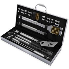 an assortment of kitchen utensils in a metal case