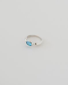 A fruity embrace for your hand to inspire early mornings in your garden. BLUE TOPAZ SIGNIFIES HEALTHY COMMUNICATION AND RELATIONSHIPS. PRODUCT DETAILS: 8MM x 6MM AA NATURAL SWISS BLUE TOPAZ 5MM WIDE DOME SHANK TAPERING TO 2MM AT BACK CAST WEIGHT: SIZE 7 / SILVER = 5.25G +/- SIZE 7 / SOLID 14KY = 6.5G +/- MADE-TO-ORDER LEAD TIMES: .925 STERLING SILVER & 14K GOLD: 2-3 WEEKS 14K GOLD VERMEIL: 3-4 WEEKS RING SIZING TIPS: GET OUR FREE RING SIZER RESIZING SERVICES START AT $20 Modern Blue Birthstone Ring For Gift, Adjustable Blue Rings For Promise, Blue Handmade Birthstone Ring For Promise, Blue Oval Birthstone Promise Ring, Handmade Blue Birthstone Promise Ring, Silver Blue Topaz Ring With Prong Setting, Adjustable Blue Promise Rings, Handmade Blue Birthstone Ring, Blue Topaz Open Ring Jewelry