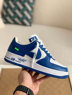 Embrace iconic style with these statement-making sneakers inspired by the legendary Louis Vuitton x Nike Air Force 1 collaboration. The vibrant blue leather upper, accented with the signature Louis Vuitton monogram, exudes luxury and street-style cool. Off-White™-inspired details add a contemporary edge, like the quoted "AIR" branding and exposed stitching. Step into the spotlight with these coveted kicks that blend high-fashion and sneaker culture. Your order arrives in a branded shoe box, comp Lv Air Force 1, Lv X Nike, Sneaker Culture, Tenis Nike, Baskets Nike, Iconic Style, Bhutan, Blue Sneakers, Air Force 1 Low