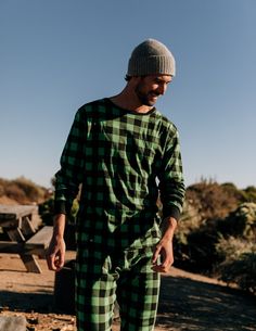 Having a stylish and cozy pair of sleepwear has never been easier with the Men’s Black & Green Plaid Cotton Pajamas. This comfy two-piece set is not only imported but will easily match with other similar family sets for some festive fun. The set consists of a long-sleeved shirt and pants, both with a black and green plaid pattern. Every product is made of 100% soft cotton and offers sizes from Small to 6XL. Pajamas also have ribbed cuffs at the ankles and wrists for extra comfort, along with an Matching Prints, Red Buffalo Plaid, Cotton Pajamas, Night Wear, Mens Plaid, Plaid Fashion, Ankle Cuffs, Cotton Pyjamas, Slim Pants