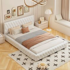 a large bed sitting on top of a hard wood floor next to a white rug