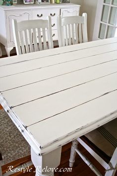 a white table and chairs in a room