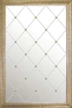 an ornate gold framed mirror with diamond patterning on the front and back sides,