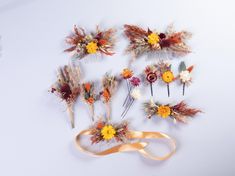 several different types of hair combs with flowers and leaves on them are laid out