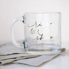 a clear coffee mug sitting on top of a table