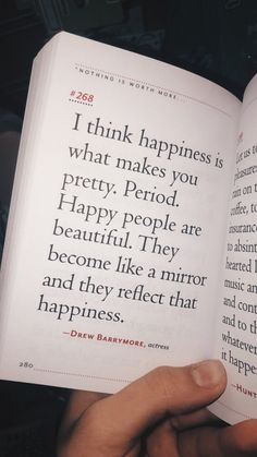 someone is holding an open book in their hand and it says, i think happiness is what makes you pretty period happy people are beautiful they become