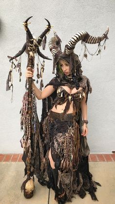 a woman dressed in costume with horns and feathers