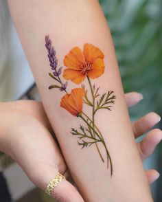 two orange flowers on the left forearm and one purple flower on the right arm, both with green stems