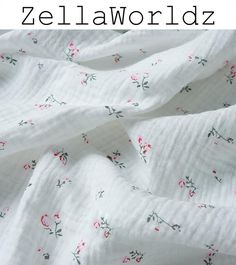 a white sheet with pink flowers on it and the words zellaworlddz