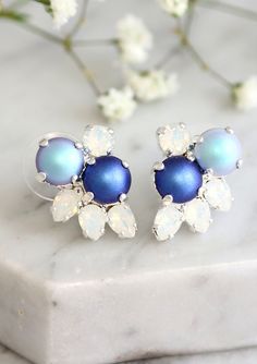 "Blue Earrings, Bridal Blue Pearl Earrings, Swarovski Blue Royal Earrings, Blue Bridal Cluster Earrings, Pearl Earrings, Bridesmaids Earrings These fabulous vintage-inspired earrings can be worn in a variety of ways for many occasions. The classic styling & Crystals make these earrings timeless. Details : ♥ U.S packages shipped via USPS® insured+USPS® tracking number ♥ 1-year guarantee ♥ Materials- 14k Gold or Silver Plated over brass CRYSTALLIZED™ Swarovski Element ♥ Post on top ♥ Size appr Elegant Blue Round Cluster Earrings, Classic Blue Round Pearl Earrings, Elegant Blue Clip-on Earrings For Weddings, Elegant Blue Gemstone Cluster Earrings, Light Blue Gemstone Round Earrings, Royal Earrings, Blue Pearl Earrings, Vintage Inspired Earrings, Bridesmaids Earrings