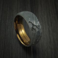 This 8mm Damascus Steel Ring has an Rock Hammer Acid finish and a Bronze Anodized Titanium Sleeve. There is a custom Antler Engraving on the top of the ring. You have the option to use your own design as well. Each ring is custom made and the pattern unique, so no two rings are exactly alike. Damascus Steel rings are v Antler Engraving, Mens Jewelry Diy, Damascus Steel Ring, Anodized Titanium, Antique Engagement Ring, Hammered Band, Titanium Rings