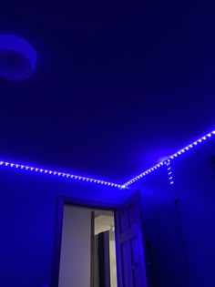 a room with blue lights on the ceiling