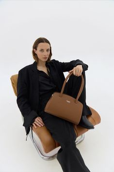 The Tan Leather Shoulder Bag Margot is a must-have for anyone with style. With its spacious, structured design, it offers functionality and elegance. Handcrafted with attention to detail, it complements any outfit, in an enduring piece. Versatile Top Handle Baguette Bag For Business, Elegant Top Handle Baguette Bag For Work, Modern Business Satchel Baguette Bag, Modern Business Baguette Satchel Bag, Classic Business Tote Baguette Bag, Classic Business Baguette Bag Tote, Classic Business Baguette Tote Bag, Business Satchel Baguette Bag With Removable Pouch, Classic Business Baguette Shoulder Bag