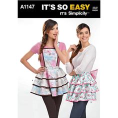 two women in aprons and dresses posing for the camera with their hands on their hips