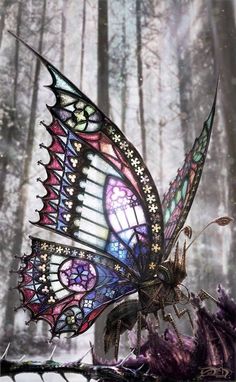 a stained glass butterfly sitting on top of a tree stump in the woods with sunlight streaming through it's wings