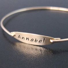 "Name Bracelet - I hand stamp these dainty name bracelets on your choice of oval plate in the following finishes; 14k gold filled, sterling silver, or 14k rose gold filled. I then create a bangle band in the matching metal. I can usually fit up to 9 characters including letters and spaces for names or words in this timeless handwritten font for your hand stamped bracelet. I can also stamp dates such as 11.28.2014 or 11-28-2014. Just let me know what you want stamped in personalized notes during Name Plate Bracelet, Bracelet Name, Handstamped Bracelet, Stamped Bracelet, Name Jewelry, Gold Bangle Bracelet, Name Bracelet, Personalized Bracelets, Custom Bracelets