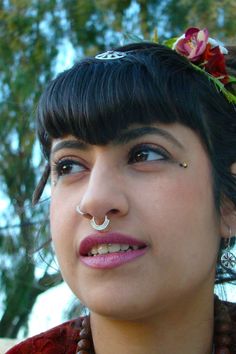 a close up of a person with a nose ring