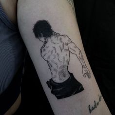 a man's arm with a tattoo on it that has an image of a shirtless body