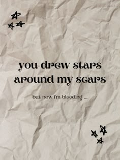 this is a poster with the heartbreaking lyrics "you drew stars around my scars but now i'm bleeding" from taylor swift's song cardigan. the text is arranged in the center of the page (in black), and the "but now i'm bleeding part" is a much smaller font size as if it's an afterthought. there are two clumps of three stars on the upper left and lower right corners. the background of the poster is a crumpled up piece of paper. Cardigan Poster, Anime Low Quality, Archive Aesthetic, T Swift, Swift 3