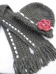 a knitted scarf with a flower on it