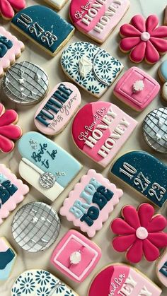 decorated cookies are arranged on a table