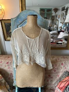 "Beautiful top , around the twenties. Tulle with hand embroidery . Probably a top of an antic wedding dress. Wonderful item. Old white. It is a fragile item, but you can still wear it with care.  You see one \" hole\" on the pictures.. easy repairing . It is at the end... Length: 39 cm From armpit to the other: 57 cm So beautiful on a mannequin. And wearing sometimes  :" Embroidered Cream Tops For Wedding, Cream Embroidered Wedding Tops, Sheer Lace Top For Summer Wedding, Sheer Lace Top For Wedding, Summer Wedding Sheer Lace Top, White Lace Top With Intricate Embroidery, White Lace Tops With Intricate Embroidery, Vintage Tops For Summer Weddings, Victorian Lace Tops For Wedding