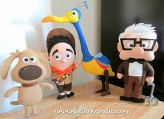 three cartoon characters are standing on a table with one dog and the other is holding a bird