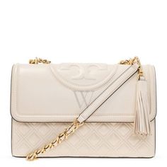 Tory Burch Shoulder Bag. SKU: 76997-122. Color: New Cream. Size: H 7.1" x L 10.6" x D 3.3". Tory Burch New Cream Fleming Convertible Leather Shoulder Bag. The Fleming bag features Napa leather construction, a flap with a magnetic snap closure, and a convertible chain and leather shoulder strap with a 22.2" (56.5 cm) drop and a leather shoulder guard for added comfort; it also includes an exterior back slit pocket, two interior pockets, one interior zipper pocket, and a clip-on leather tassel. 100% Leather. Shoulder Guard, Tory Burch Shoulder Bag, Versace Watch, Tory Burch Handbags, Fine Pens, Cheap Gifts, Denim Shoes, Crossbody Messenger Bag, Fragrance Gift Set