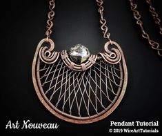 an art nouveau necklace with a wire work design