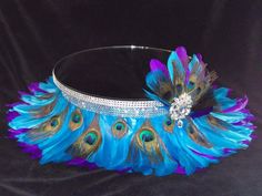 a tiara with peacock feathers and jewels