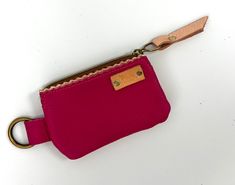 Every girl needs a cutie zip to add to their Indigo Laine collection. Made of 100% leather in the heart of South Texas, this bag carries cards, cash and a lipstick with ease. Carry it solo or stack it with our Sheila Wristlet, Uptown Zip and fun leather tassel! Make it your own! Measures 5” X 3.5” Features a 1” brass ring perfect for clipping to a wristlet. Made in TX Pink Coin Purse With Cell Phone Pocket, Pink Coin Purse With Cell Phone Pocket For Gift, Pink Leather Wallet Gift, Pink Leather Wallet For Gift, Pink Leather Wallet As Gift, Pink Leather Wallet Perfect As Gift, Pink Coin Purse With Interior Card Slots, Pink Wallets With Zipper Pocket For Everyday Use, Pink Leather Coin Purse For Gift