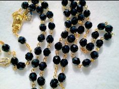 The 8mm beads are opaque black in color. Entire rosary is 18K gold plated. Italian made & designed crucifix measures 2" long x 1-1/4" wide. Rosary length is 23" long. Bead Rosary, 8mm Beads, The Czech Republic, Black Crystals, Rosary, Czech Republic, Crystal Beads, 18k Gold, Gold Plate