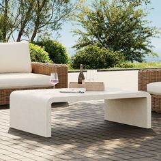 a white table sitting on top of a brick patio