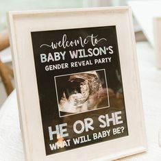 a sign that reads welcome to baby wilson's gender reveal party he or she what will baby be?